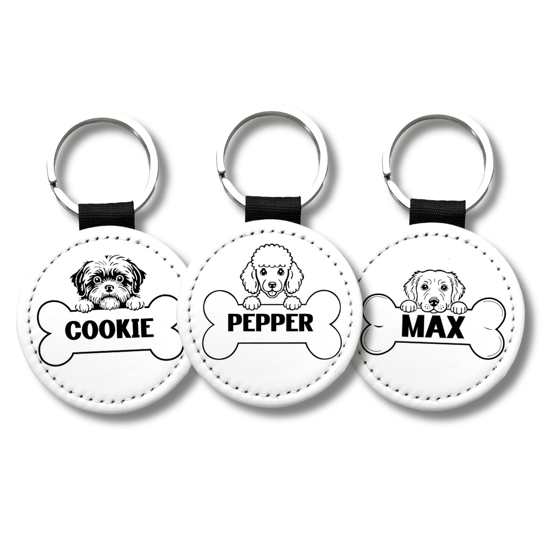 Personalized dog name keychains featuring custom pet names Cookie Pepper and Max with breed illustrations on round white keychains