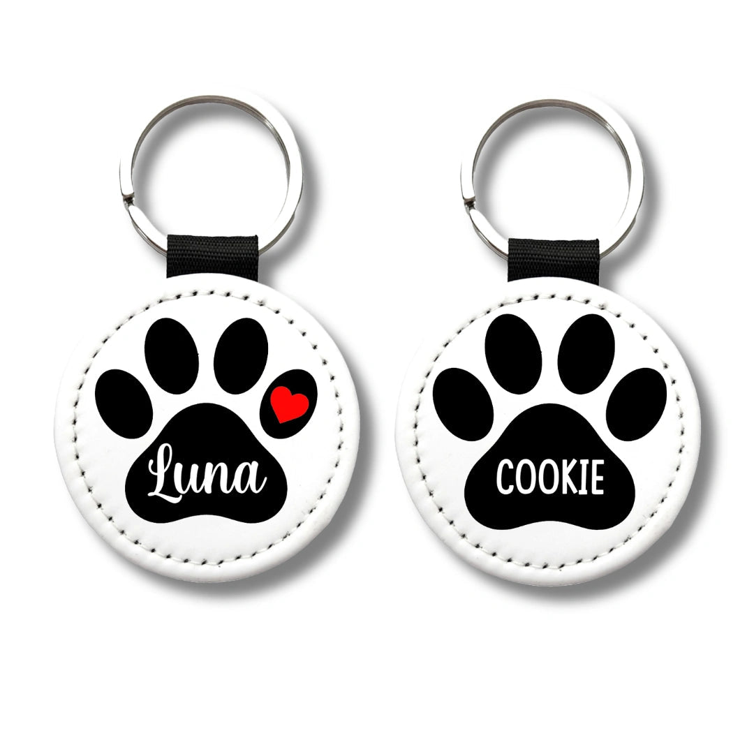 Two personalized paw print keychains with names Luna and Cookie on a clean white background