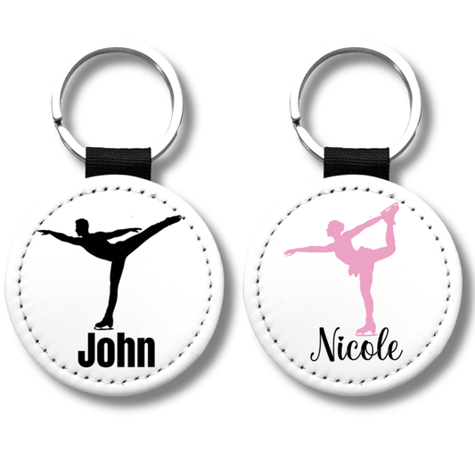 Personalized figure skating keychains with custom skater names and colored skating silhouettes attached to gym bags, perfect team gifts for skating clubs and competitions.