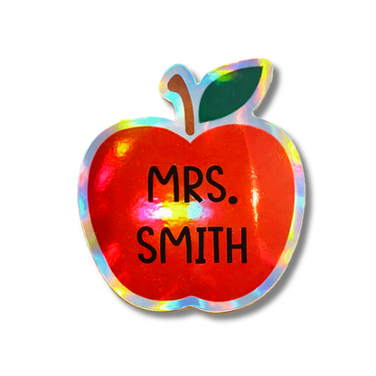 Personalized holographic teacher name sticker with apple design. Custom vinyl decal perfect for back to school and teacher gifts.