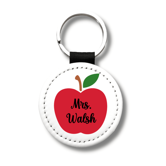 Custom teacher apple keychain made from PU leather with personalized name. Perfect teacher appreciation, back to school, and end-of-year gift.